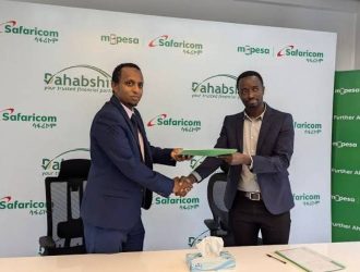 Dahabshiil country representative in Ethiopia Musse Mohamed (left) and MPESA Safaricom Acting Chief Digital Financial Services Anthony Kangethe during the signing of the partnership in Addis Ababa. [Courtesy]
